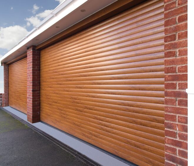 A close-up of two double roller wooden garage doors with a horizontal slat design, set against a brick wall.